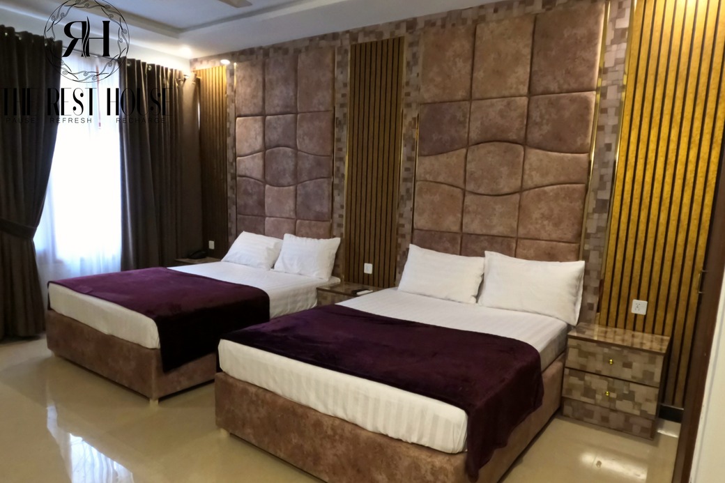 F-8 Guest House - Spacious living area with elegant decor