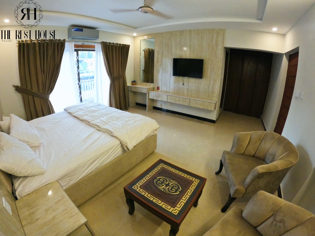 F-8 Guest House - Comfortable bedroom with premium furnishings
